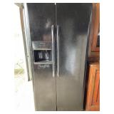 Frigidaire side-by-side refrigerator with water