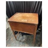 Vintage kenmore sewing machine in cabinet.