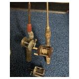 Two Steel Fishing Rods, One with Ideal Real other