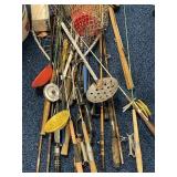 Lot of fishing poles, ice fishing supplies,