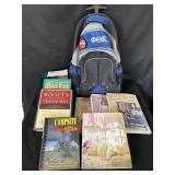 Lot of several books and backpack with