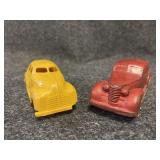 Vintage auburn rubber red car and yellow taxi