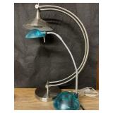 Two desk lamps teal one with bendable neck. Both