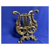 Heavy gold gilt cast iron magazine rack 11" tall