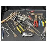 Large selection of tools including pliers, wire