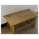 Raw finish wood slat bench