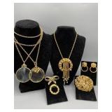 Group of necklaces earrings and pins
