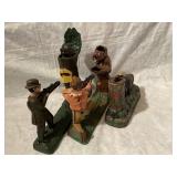 Group of three cast-iron banks, the two with guns