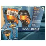 Set of seven solar lights amber colored new in