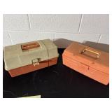 Two tackle boxes with an assortment of items