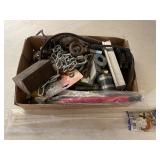 Tree full of miscellaneous garage items including