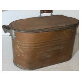 Copper tub with wooden handles measures 24 inches