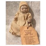 BISQUE HEAD DREAM BABY ON ORIGINAL CLOTH BODY.