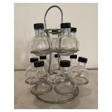Metal rack holds 12 glass containers