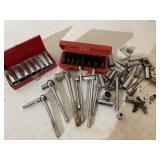 Sockets, ratchets and extensions. Numerous brands