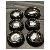 Glass amber casters. 5 measure 2 1/2 inches