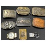 Lot of belt buckles and money clips. There are 6