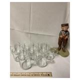 Hand carved wooden man playing golf figurine.