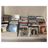 Large assortment of music CDs and cassettes Some