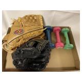 Two baseball gloves and three handweights