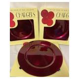 Three boxes of 13 inch red lacquer chargers, 12