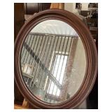 Walnut oval mirror measures 22 inches tall 19