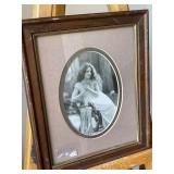 Black and white photo of a lady. Frame measures 9