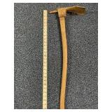 Vintage pickax measures 29 inches long with