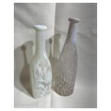 Two White and ClearGlass Bottles