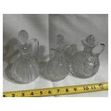 Three cruets each approximately 5 1/2 inches tall