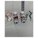 Three sets of salt and pepper pig Shakers