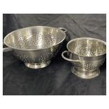 Metal strainers, one large and one small