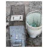 Large live trap with bucket and neat.