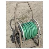 Hose reel with hose. Looks to have two hoses