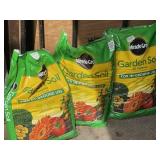 Two new bags of garden soil and one partial.