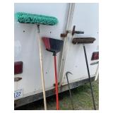Lot of brooms, two push brooms, one house and one
