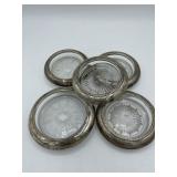 Set of five Sterling silver and glass coasters.