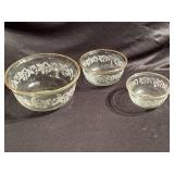 Bowl set with gold rim and leaf design.