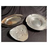 Two hammered aluminum trays and one tray made in