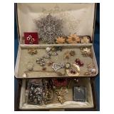 Small jewelry box full of Pins earrings bracelet