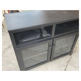 Nice tv stand with glass doors. Measures 42" x
