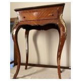 Hall table with brass accents. Measures 20 inches