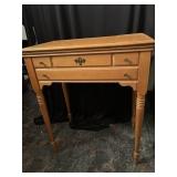 Singer sewing machine built in pine stand.