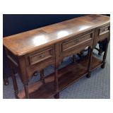 Oak sofa table with three drawers. Measures 54