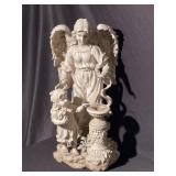 Statue of an angel watching over a little girl.