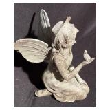 Garden fairy with bird in her hand, measures 8