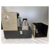 L- Polaroid 610 projector.