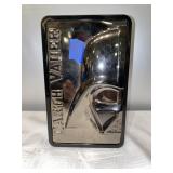 L- Darth Vader tin with 7 red packages inside.
