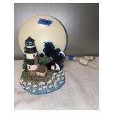 K- lighthouse water scene with moon light