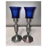 G- a pair of candlesticks blue in color.